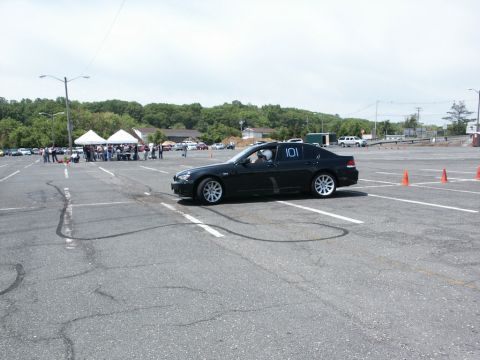 2001 Mercury Grand Marquis - A black sedan with racing number 101 is visible in a parking lot with cones.