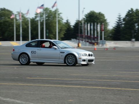 2001 Mercury Grand Marquis - Silver BMW M3 on track, likely participating in an event or race.