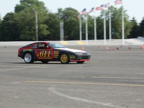 2001 Mercury Grand Marquis - Porsche 944 race car with custom graphics and number 611 competes on a track.