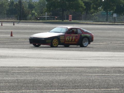 2001 Mercury Grand Marquis - Porsche 944 race car with prominent number 611 on its side, participating in an event.
