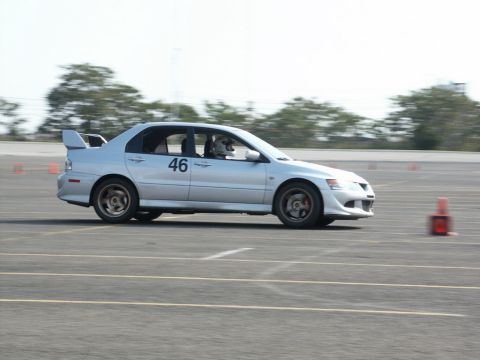 2001 Mercury Grand Marquis - Silver sedan with racing number 46 on door navigates a track with cones.