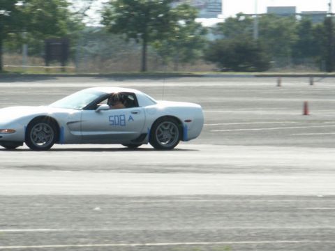 2001 Mercury Grand Marquis - A silver sports car, identified by the number 508 on its door, navigates a track during an event.