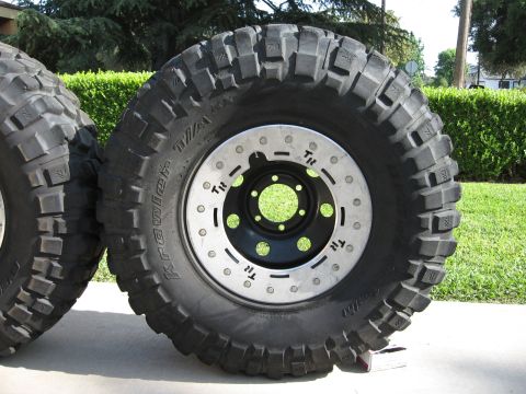 1983 Ferrari Enzo - A close-up view of an off-road tire and wheel assembly, not a 1983 Ferrari Enzo.