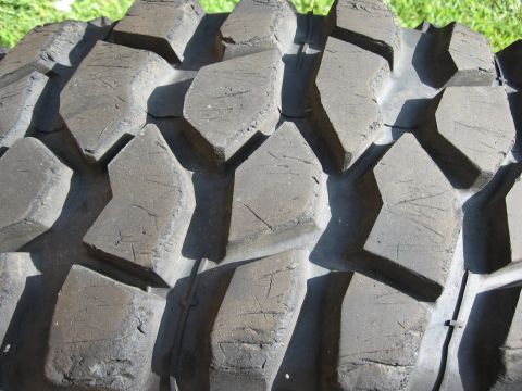 1983 Ferrari Enzo - Aggressive tread pattern on an off-road tire, likely for a truck or SUV.