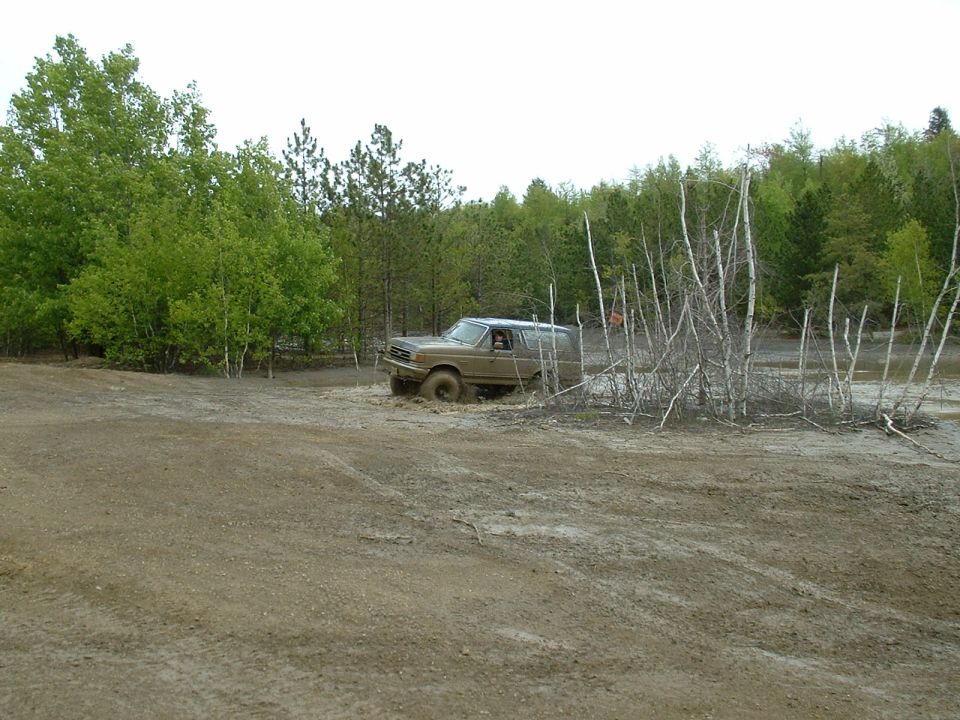 1991 Ford Bronco stuck in mud off-road