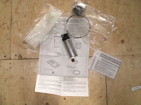 1995 Ford Probe - Fuel pump assembly and instructions for installation are shown, with text in English and Spanish.