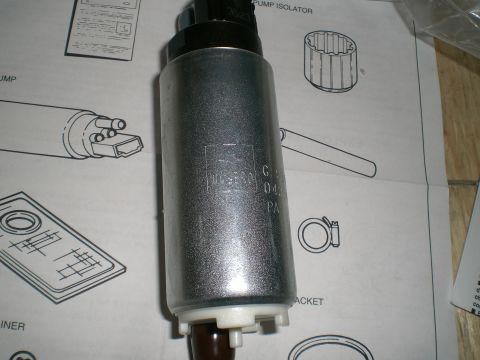 1995 Ford Probe - A silver fuel pump is shown with installation diagrams and part information visible in the background.