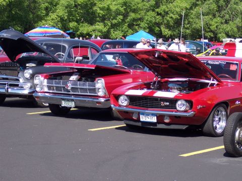 1972 Ford Ranchero - A red 1966 Ford Ranchero is displayed with its hood up at a car show.
