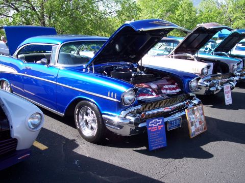 1972 Ford Ranchero - A row of classic cars are displayed with their hoods open at an outdoor event.