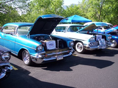 1972 Ford Ranchero - A pair of classic Chevrolets, a '57 and a '58, displayed at an outdoor car show.