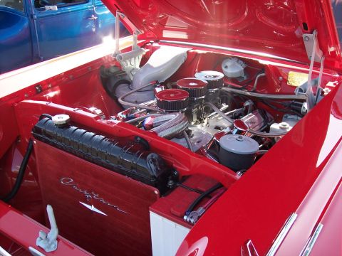 1972 Ford Ranchero - A close-up view of a V8 engine with custom modifications, including a wooden radiator shroud.