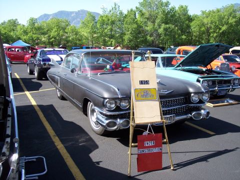 1972 Ford Ranchero - A 1959 Cadillac is displayed at an outdoor car show with other vehicles.