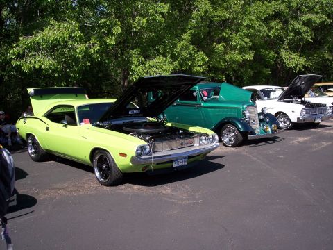 1972 Ford Ranchero - Lime green 1970 Dodge Challenger at a car show, hoods up, parked in a row.