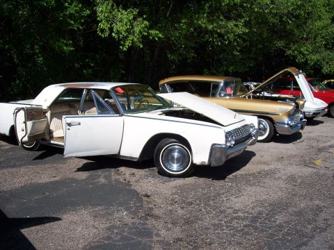 1972 Ford Ranchero - White 1963 Lincoln Continental, hood and door open, parked in a line with other classic cars.