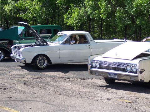 1972 Ford Ranchero - A white Ford Ranchero is parked at an outdoor event with other vehicles.