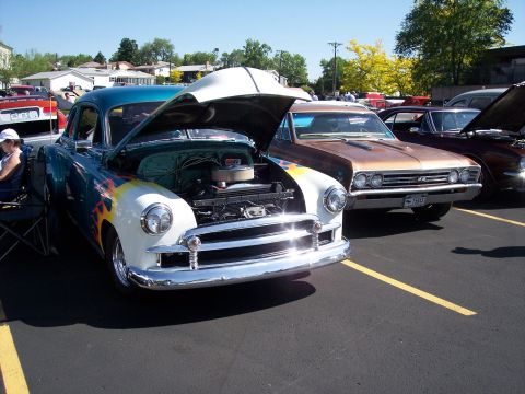1972 Ford Ranchero - A classic coupe with its hood open displays custom flame paintwork.