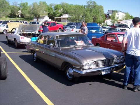 1972 Ford Ranchero - This 1960 Buick LeSabre is parked at an outdoor car show with other vehicles present.
