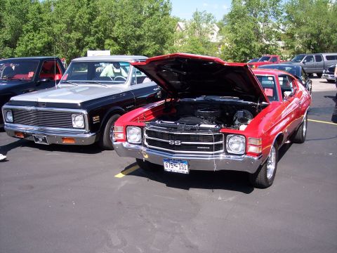 1972 Ford Ranchero - Red 1970 Chevelle SS and a pickup truck at a car show.