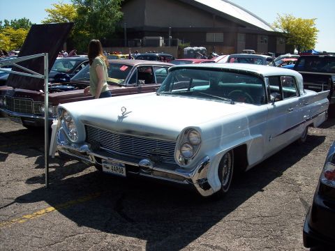 1972 Ford Ranchero - A white 1958 Lincoln Continental Mark III is parked at an outdoor event with other vehicles.