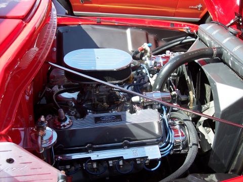 1972 Ford Ranchero - Engine bay detail showing a Ford Motorsport V8, with another car partially visible behind it.