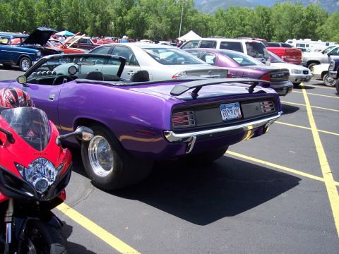 1972 Ford Ranchero - Purple 1970 Plymouth Barracuda convertible shows off its rear end and wide tires.