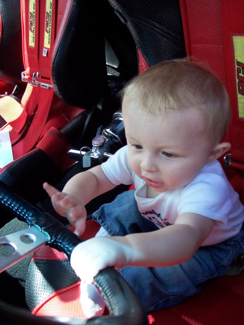 1972 Ford Ranchero - Baby gets a feel for the driver's seat, possibly in a race car.