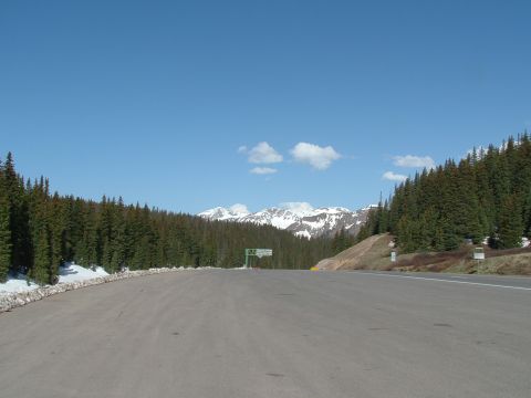2007 Kawasaki Ninja - A scenic mountain pass with a clear blue sky and snow on the peaks.