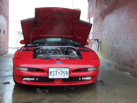 1995 Ford Probe - A red 1995 Ford Probe is parked with its hood open, facing forward, with a Maryland license plate visible.