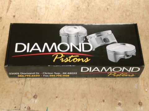 1995 Ford Probe - Box for Diamond Pistons, images of pistons and company contact information.