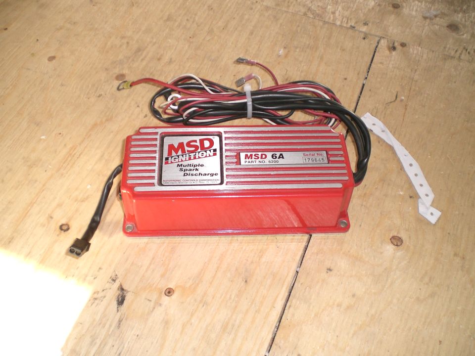 Red MSD 6A ignition box with wiring and labels