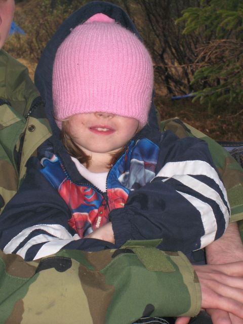 2000 Ford E350 - A young child wears a pink beanie that covers their eyes, with a Spider-Man jacket visible.