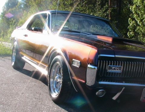 1968 Mercury Cougar - Front 3/4 view of a 1968 Mercury Cougar with a hood scoop.