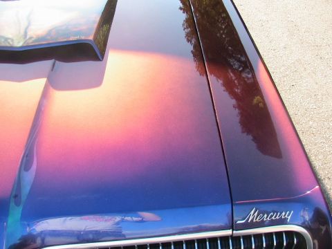 1968 Mercury Cougar - Custom paint job on the hood and fender of a 1968 Mercury Cougar, a Mercury badge.