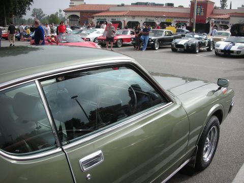 1998 Ford Crown Victoria - Car meet scene with multiple classic vehicles on display.