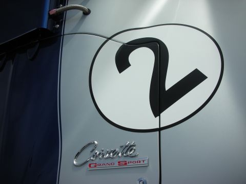 1998 Ford Crown Victoria - Close-up of a Corvette Grand Sport emblem and the number 2 on a race car.