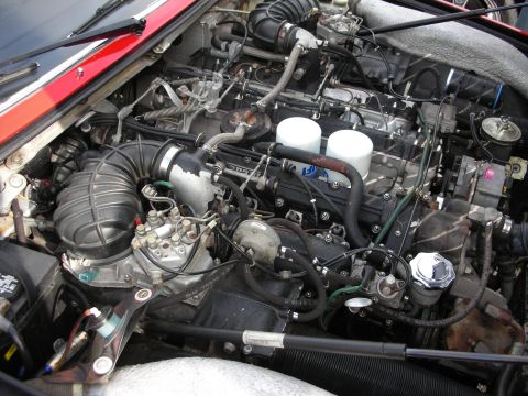 1998 Ford Crown Victoria - Close-up view of a complex engine bay, showing various mechanical components and wiring.