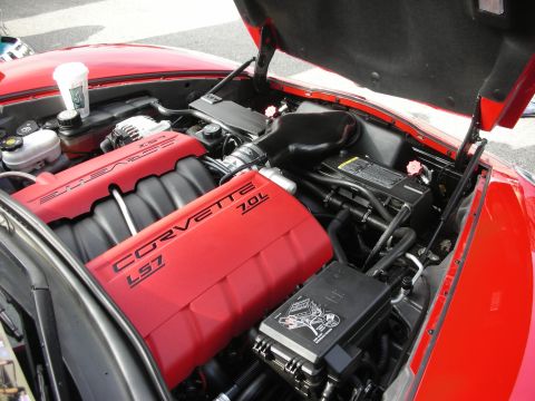 1998 Ford Crown Victoria - Close-up of a red Corvette LS7 engine, showing the 7.0L displacement.