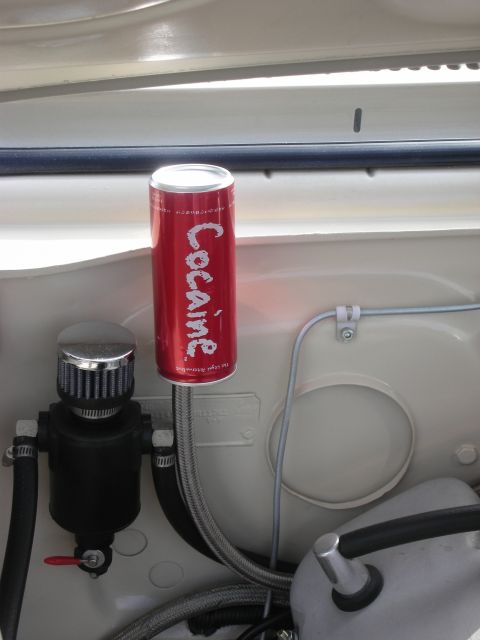 1998 Ford Crown Victoria - A novelty can is mounted in the engine bay next to an oil catch can.
