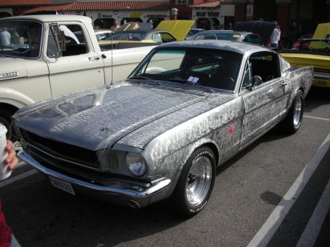 1998 Ford Crown Victoria - Custom 1965 Ford Mustang with a unique brushed metal exterior finish at a car meet.