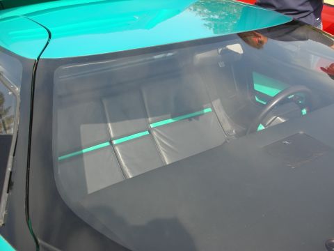 1998 Ford Crown Victoria - The distinctive interior of a DeLorean DMC-12, its iconic gull-wing door frame and quilted seats.