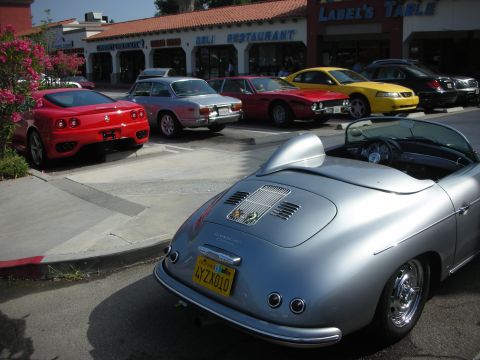 1998 Ford Crown Victoria - Several cars are parked in front of a restaurant, including a silver convertible sports car.