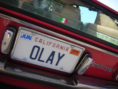 1998 Ford Crown Victoria - A red car's rear features a California license plate and "Lamborghini" badging.