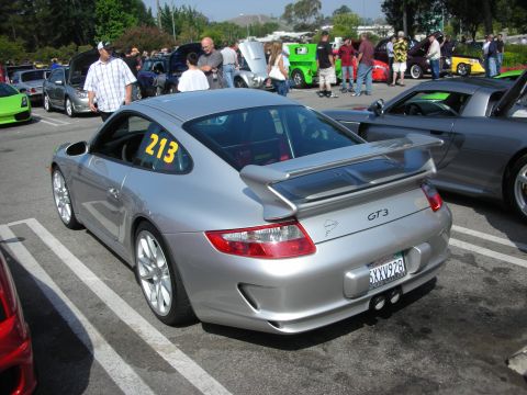 1998 Ford Crown Victoria - Silver Porsche 911 GT3 with racing number 213 visible in the rear window.