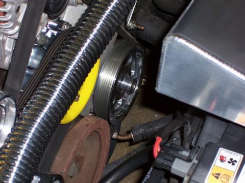 2002 Ford Mustang - A detailed view of the engine bay components, including the serpentine belt and pulleys.