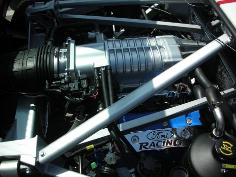1998 Ford Crown Victoria - The engine bay features a prominent supercharger and 'Ford Racing' branding on the valve covers.