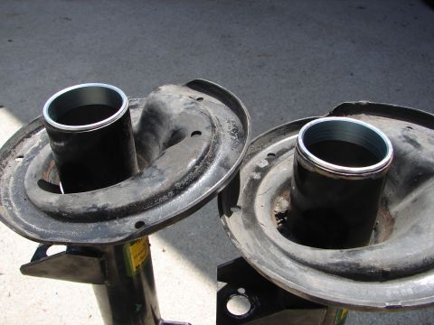 1992 Ford Taurus - Close-up of two car shock absorber assemblies, likely before installation or after removal.