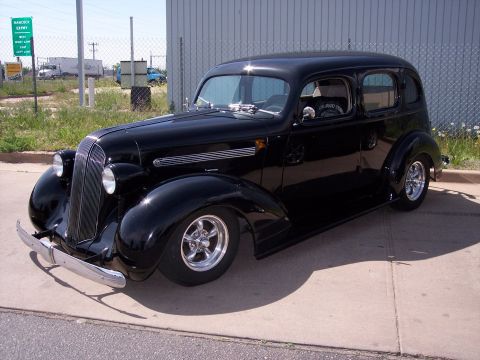 1972 Ford Ranchero - Customized 1936 sedan hot rod features chrome accents and aftermarket wheels.