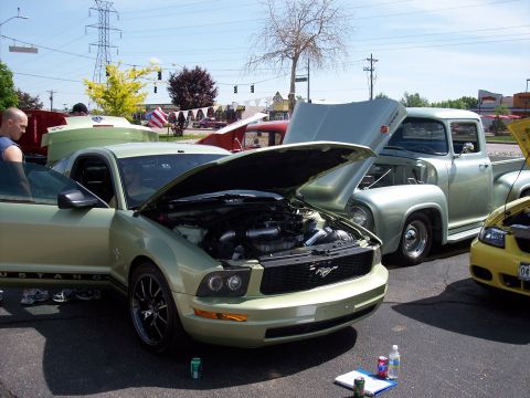 1972 Ford Ranchero - Several vehicles are displayed with their hoods open at an outdoor event.