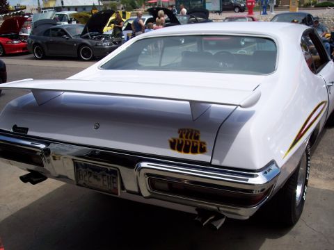 1972 Ford Ranchero - Rear view of a white 1970 Pontiac GTO Judge with a distinctive rear spoiler and emblem.