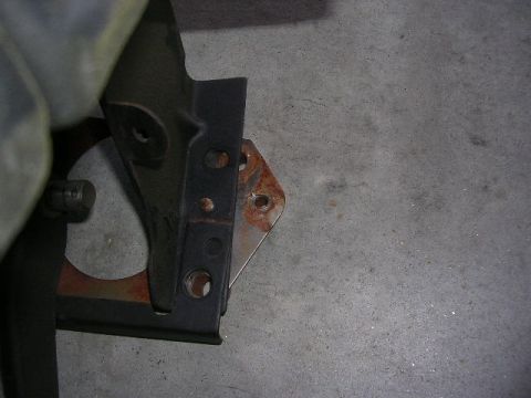 1975 Ford Ranchero - Detail of a vehicle's clutch pedal assembly, showing metal components and some rust.